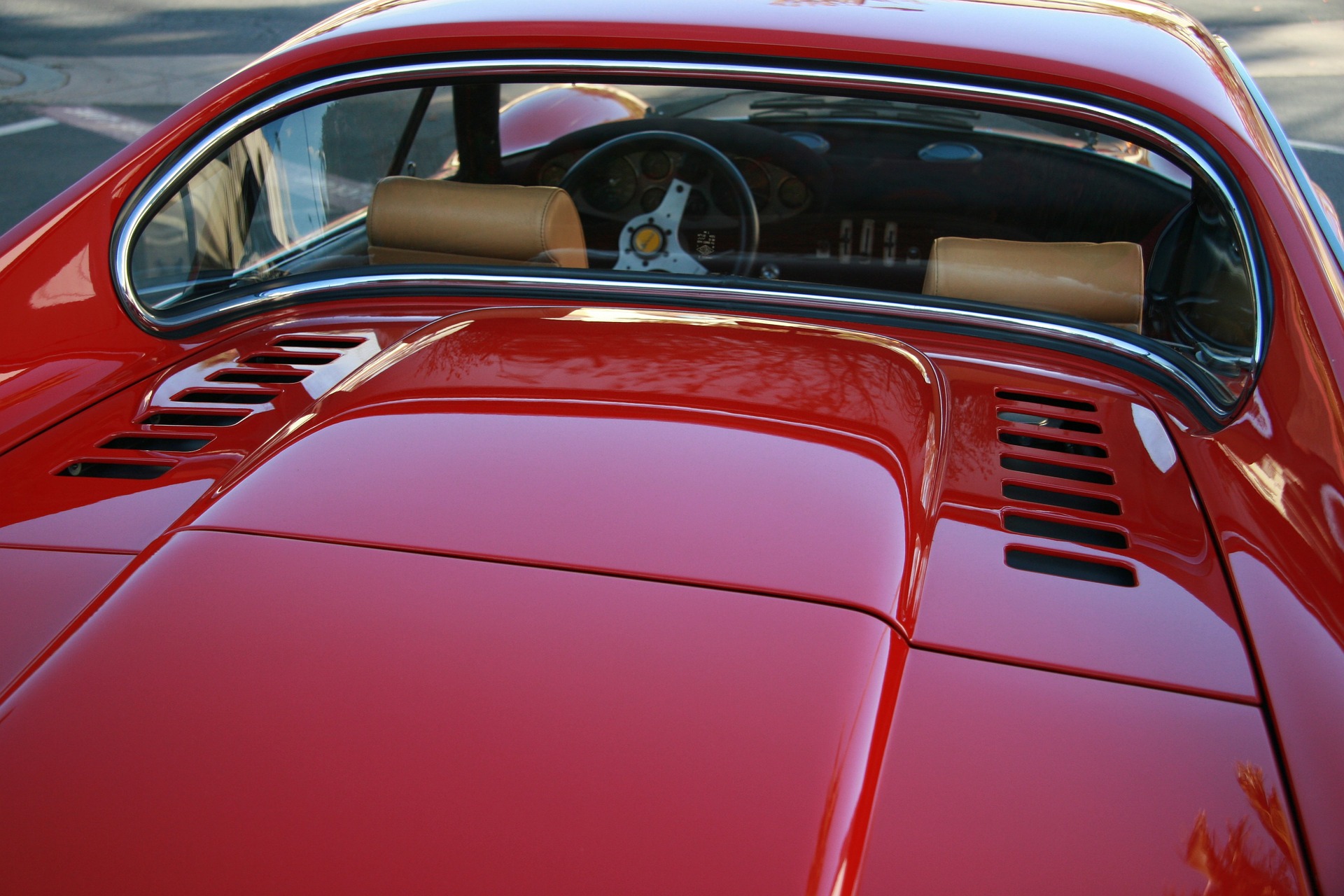 A close up of a red Ferrari from behind.