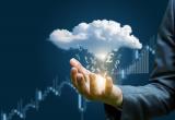 Hand with cloud floating above, money in different currencies raining from it