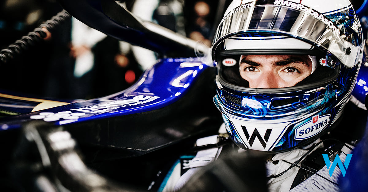 A Williams Racing driver wearing a helmet.